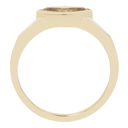 A yellow gold ring with a bezel-set round brown gemstone, shown from a top-down perspective on a white background.