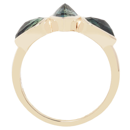 A gold ring with a three-stone crown setting featuring a central pointed green gemstone and two smaller green stones on either side, shown against a plain white background.