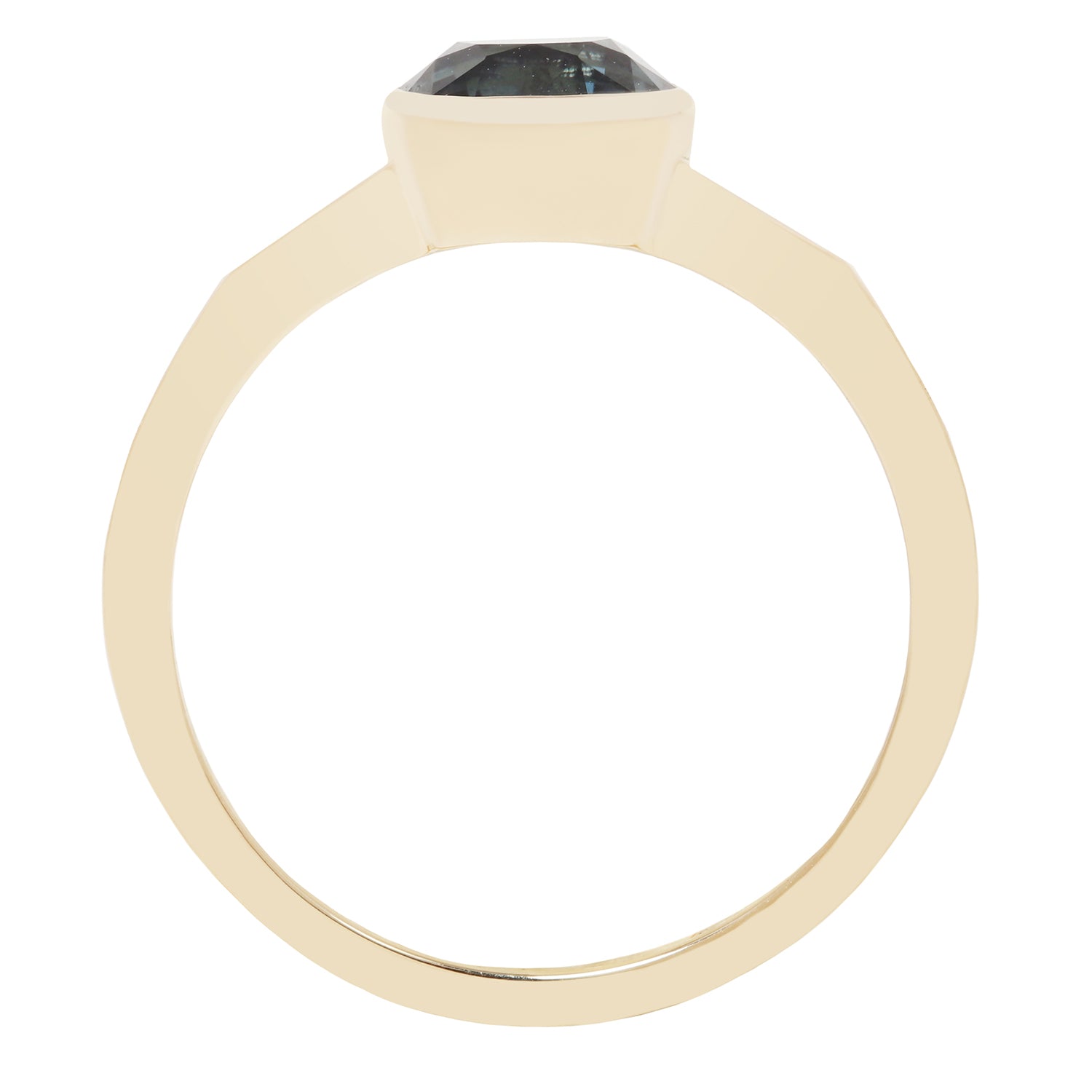 A gold ring with a large, faceted dark gray or black gemstone, shown from a top-down perspective on a plain white background.