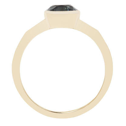 A gold ring with a large, faceted dark gray or black gemstone, shown from a top-down perspective on a plain white background.