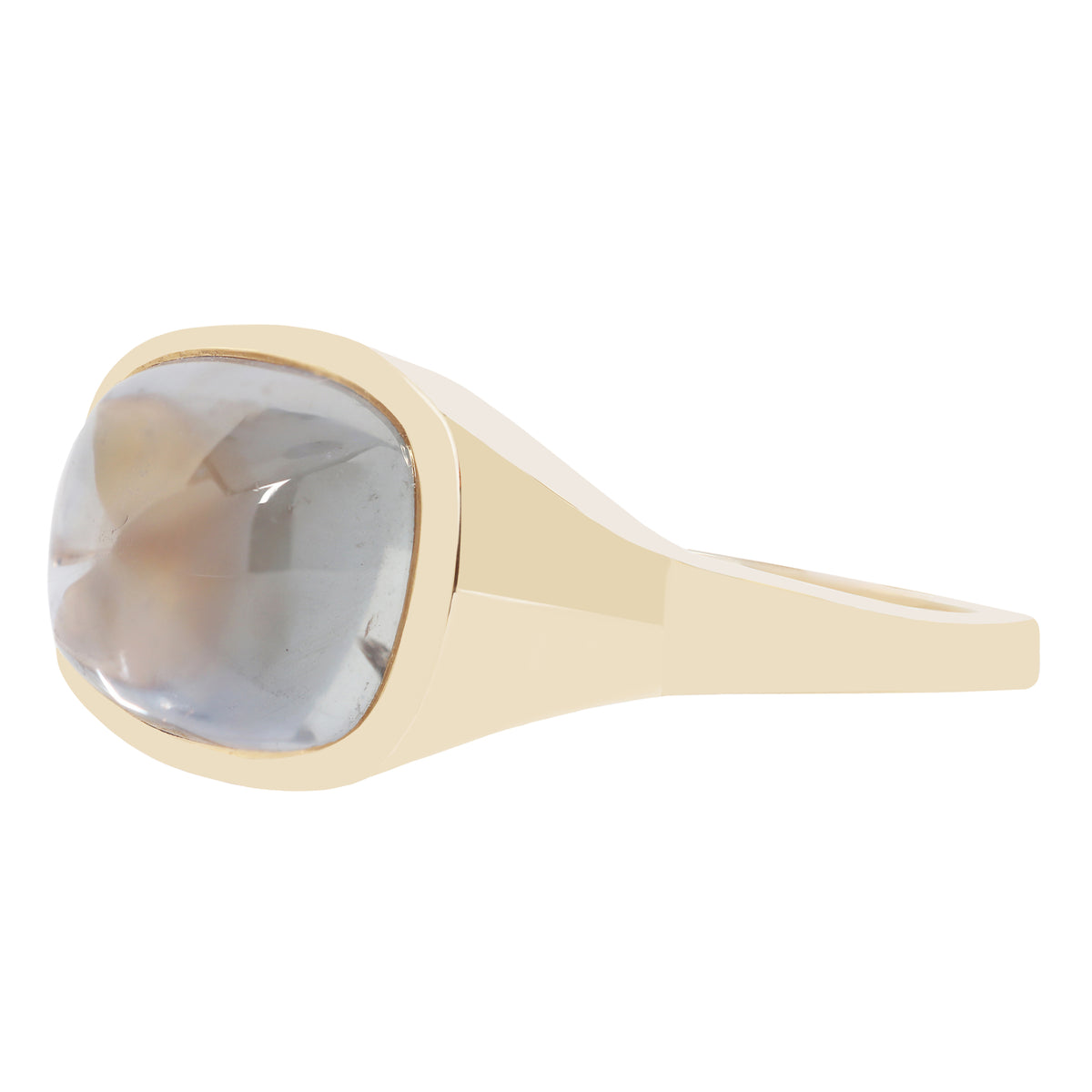 A gold ring with a large, cushion-cut translucent gray gemstone, shown against a plain white background.