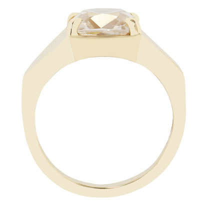 A yellow gold ring with a large, faceted clear gemstone in a square bezel setting, shown from a top-down view on a plain white background.