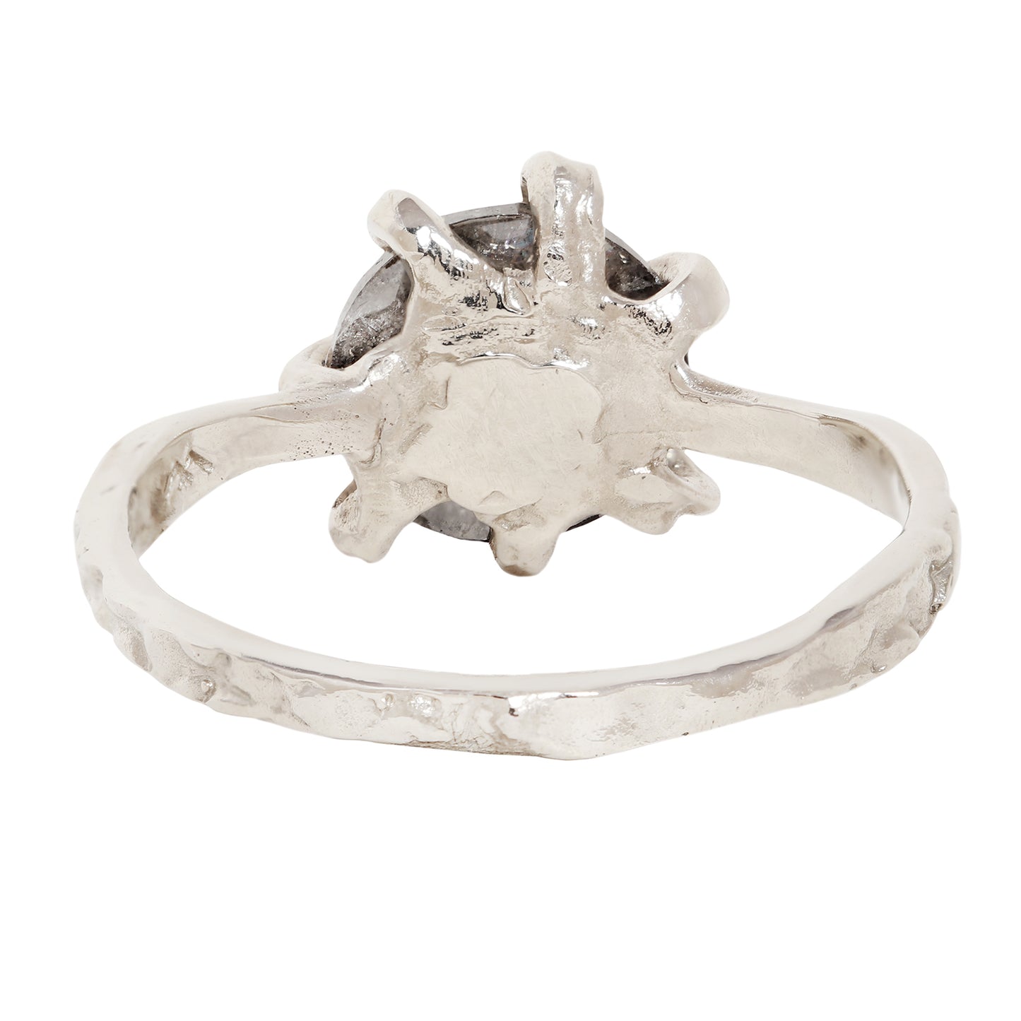 A white gold ring with a textured, organic-shaped setting and a dark gray stone, shown against a plain white background.