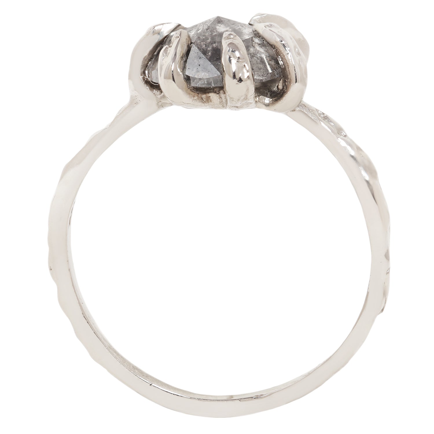 A unique white gold ring featuring a large, round, faceted gray gemstone held in a six-prong setting with textured, leaf-like prongs, mounted on a matching textured band.