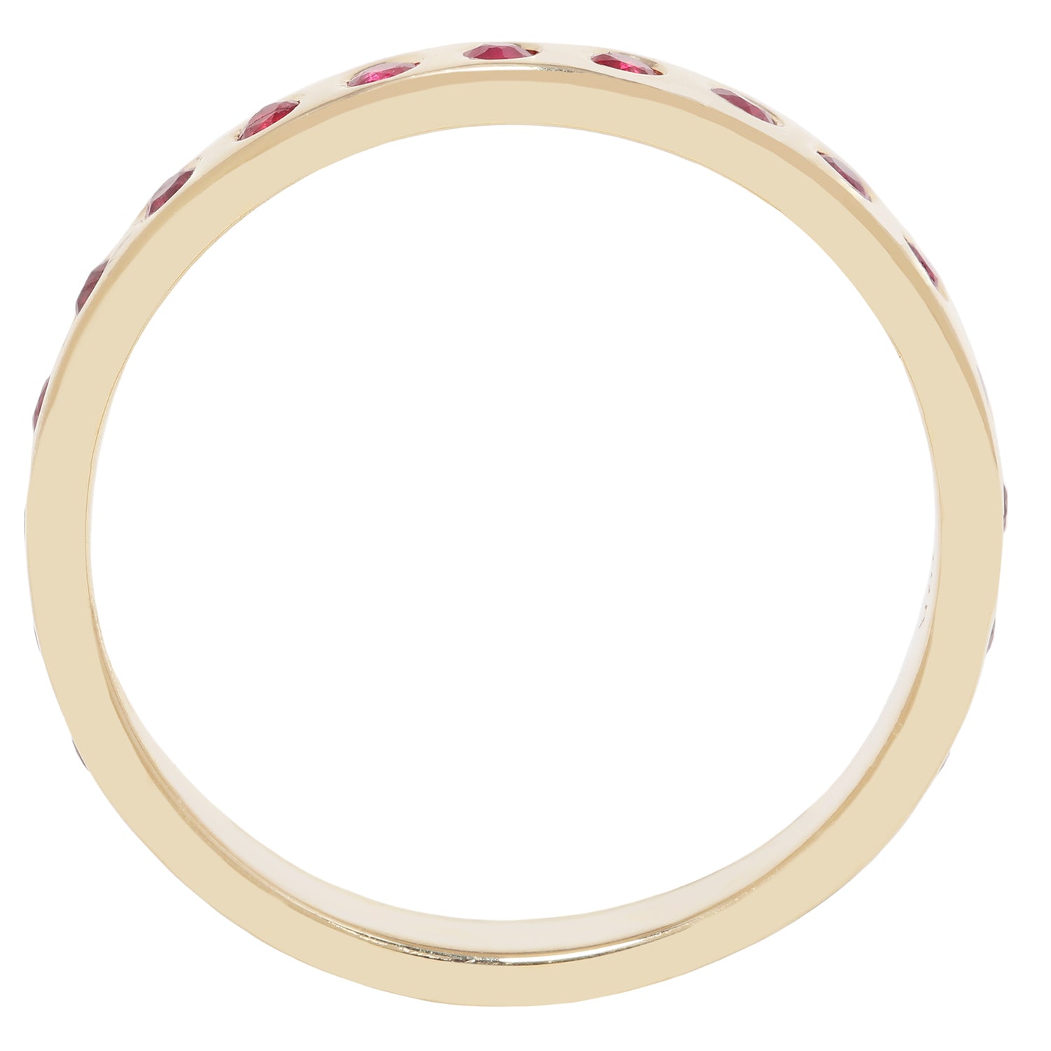 A yellow gold eternity ring featuring a continuous row of small round-cut red gemstones set around the band, shown against a solid white background.