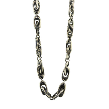 A close-up of a dark silver chain necklace with interlocking oval links, shown against a plain white background.