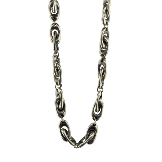 A close-up of a dark silver chain necklace with interlocking oval links, shown against a plain white background.