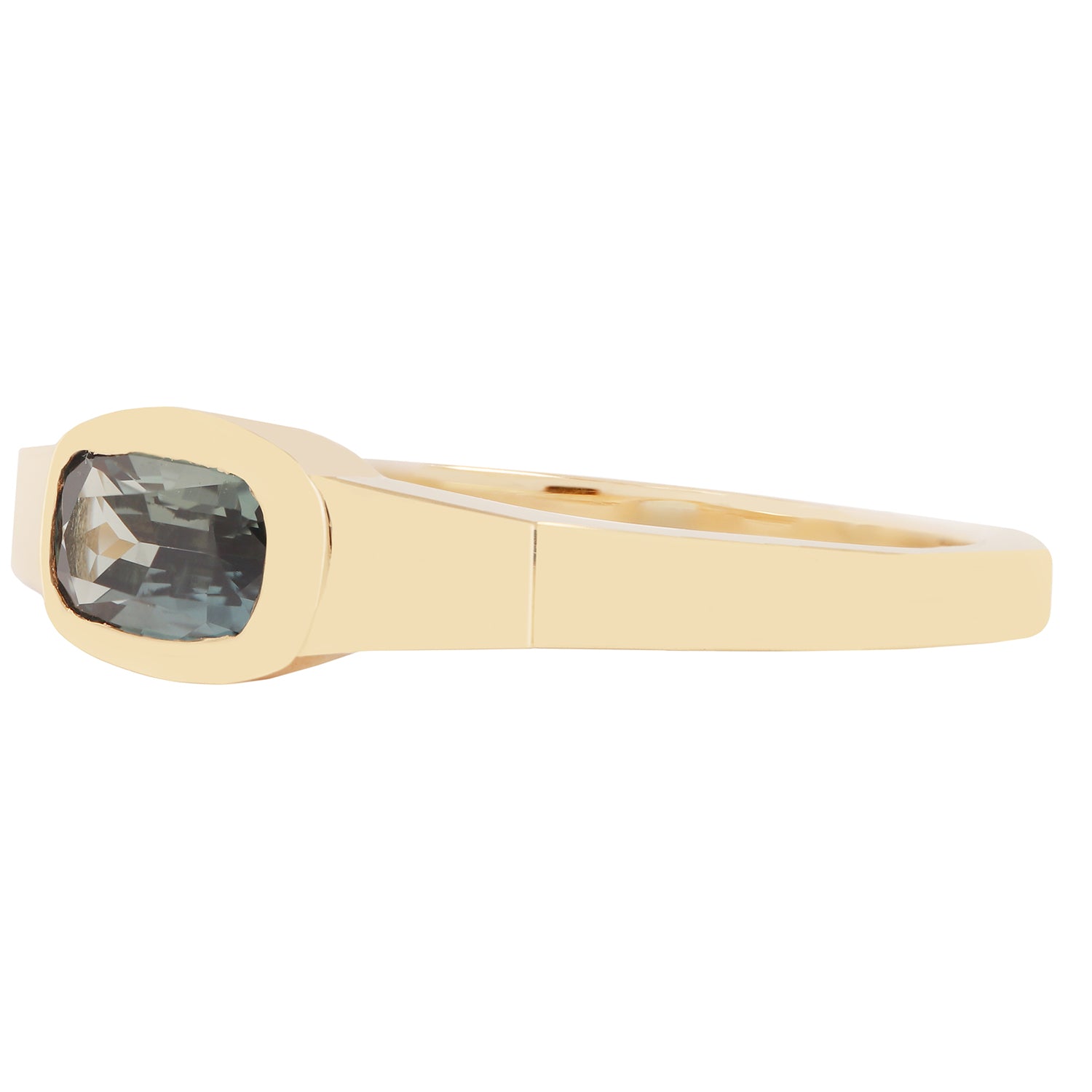 Lauren Wolf - Gold ring with a blue gemstone on a white background