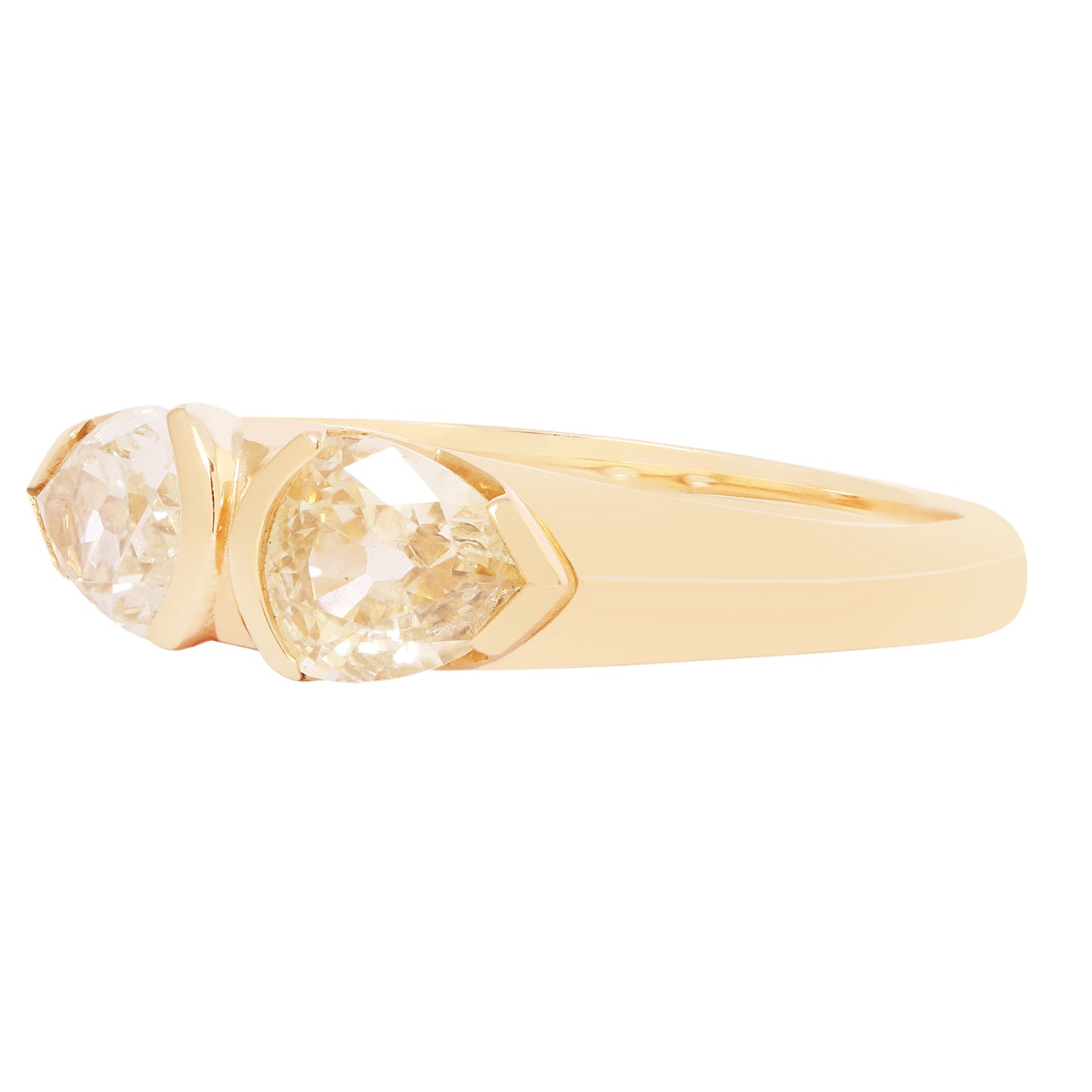 Gold ring with a clear gemstone on a white background