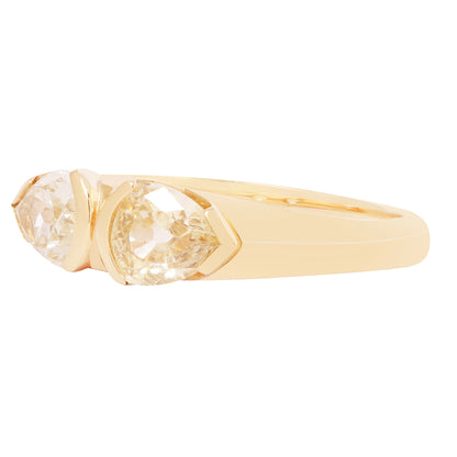 Gold ring with a clear gemstone on a white background