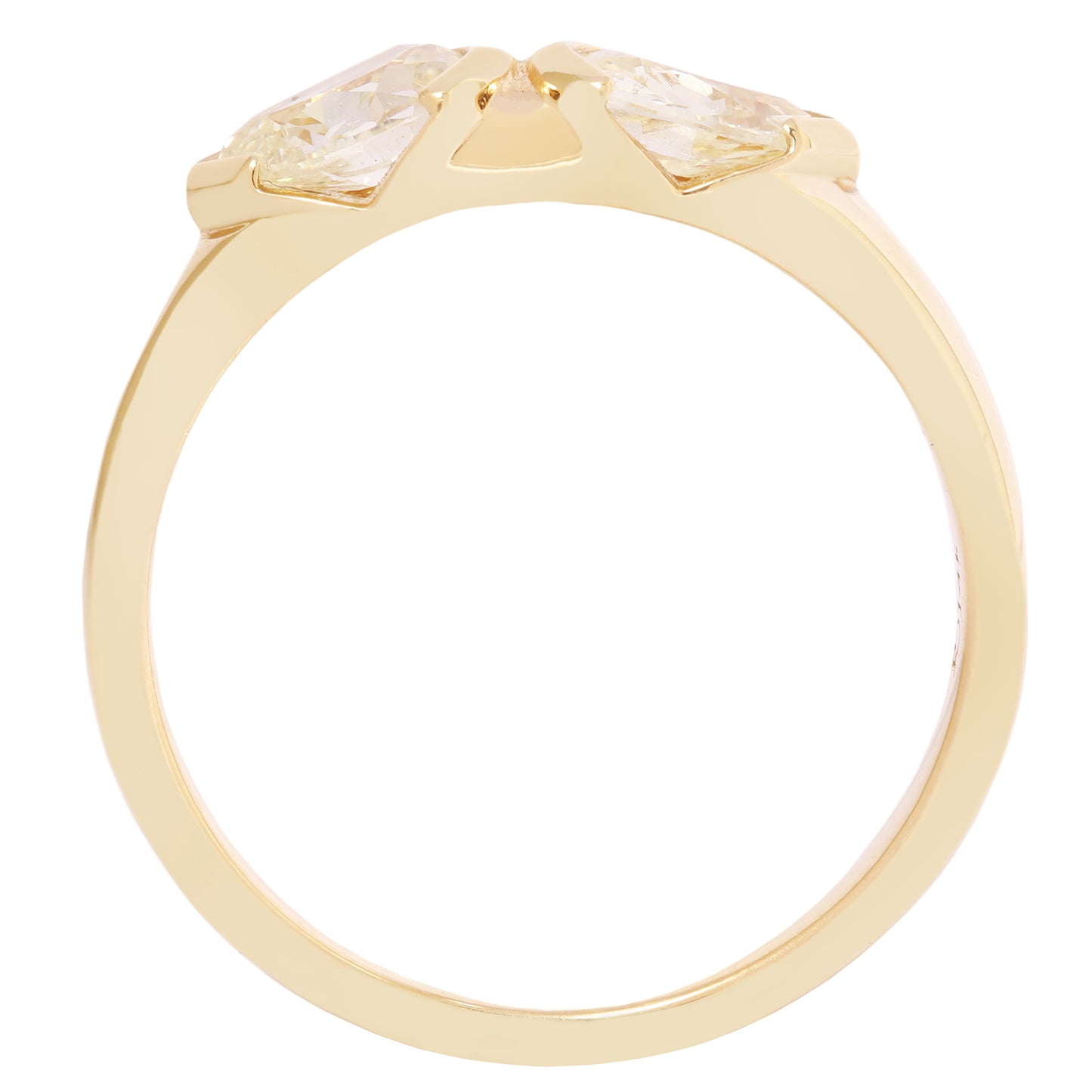 Gold ring with two clear gemstones on a white background