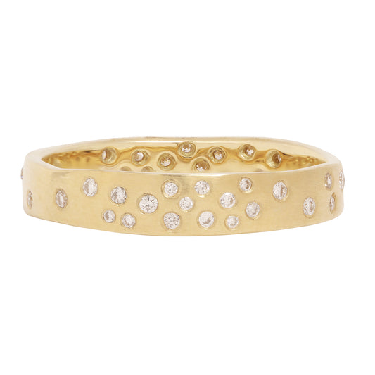 Satomi Kawakita - Gold ring with diamond accents on a white background