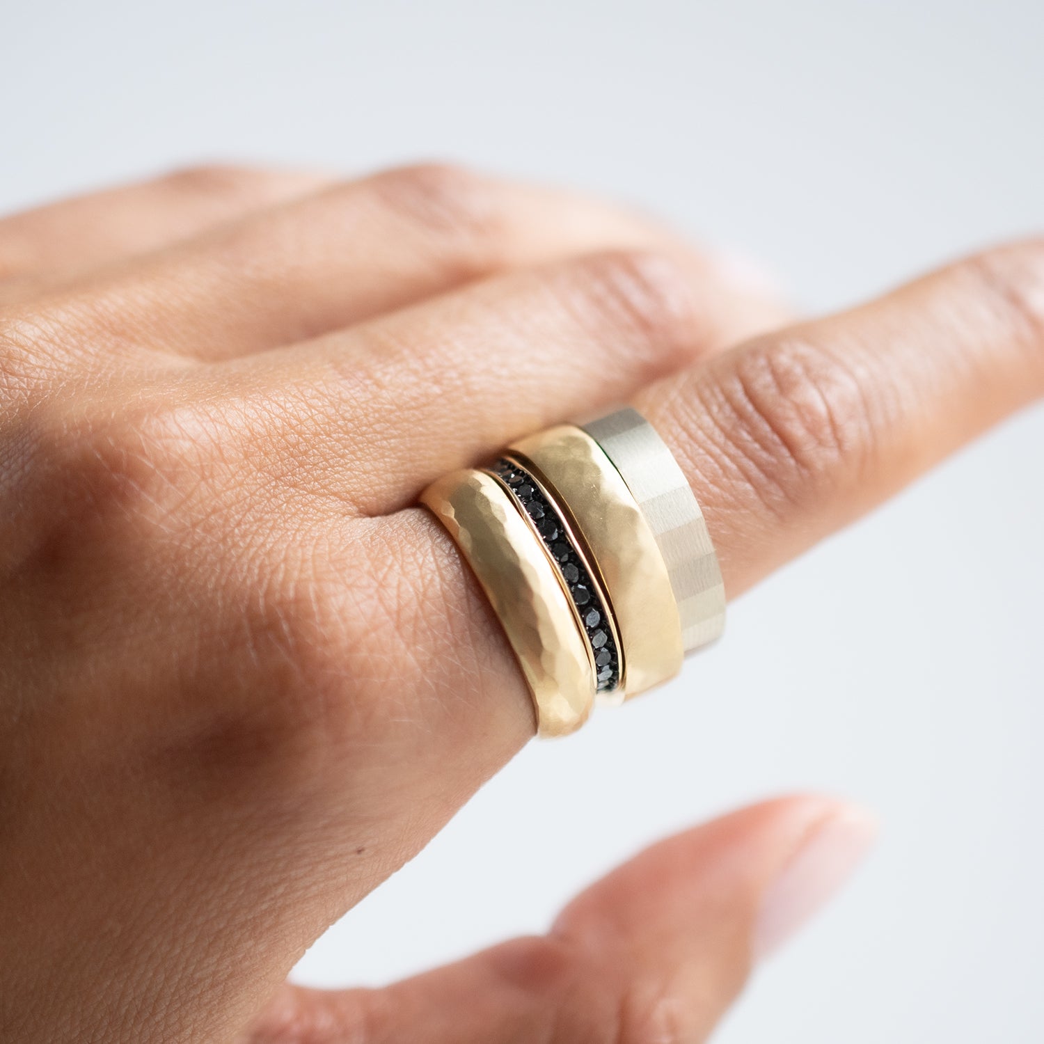 Satomi Kawakita - Stack of multiple rings on hand