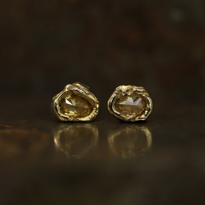 Ellis Mhairi Cameron - Pair of gold earrings with a dark background
