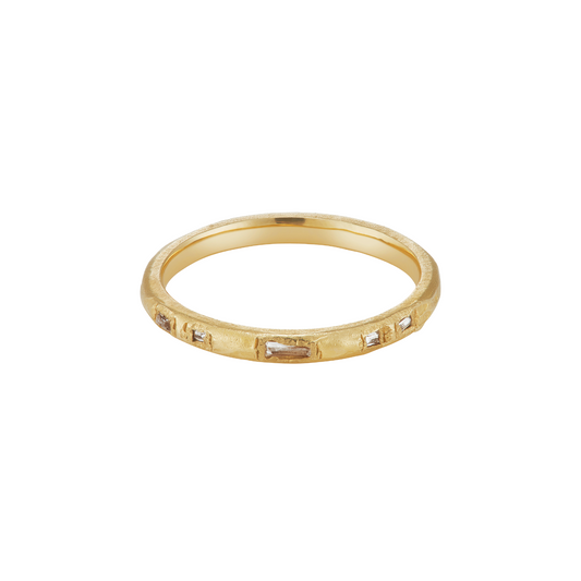 Ellis Mhairi Cameron - Gold ring with small stones on a white background