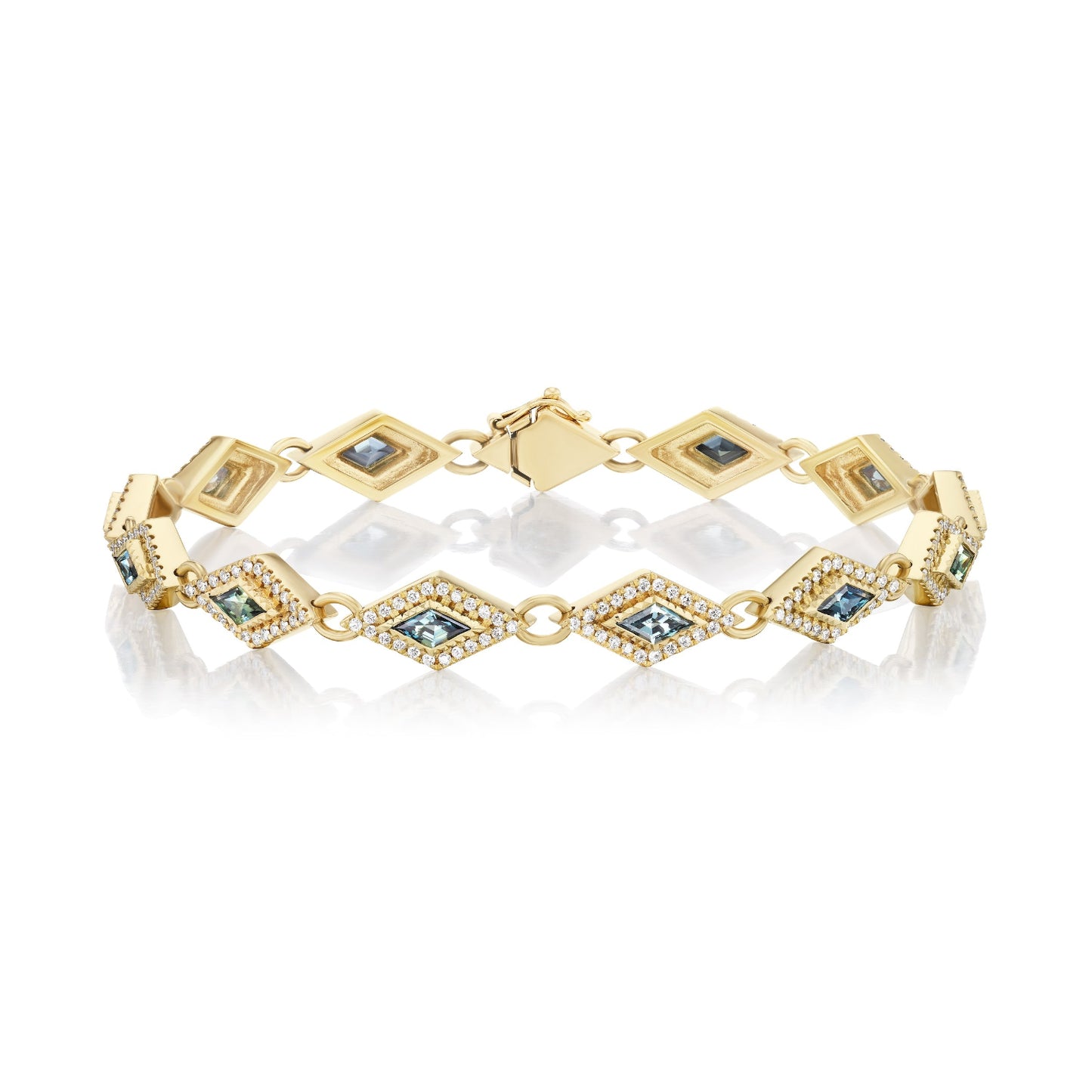 Gold bracelet with embedded blue stones on a white background