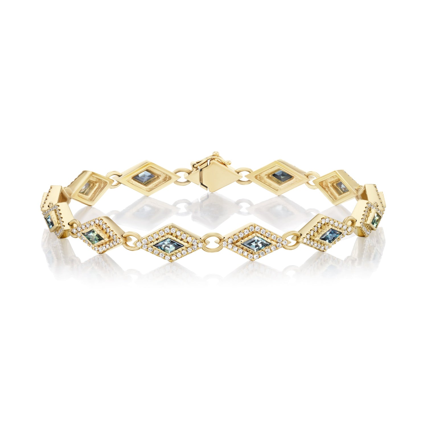 Gold bracelet with embedded blue stones on a white background