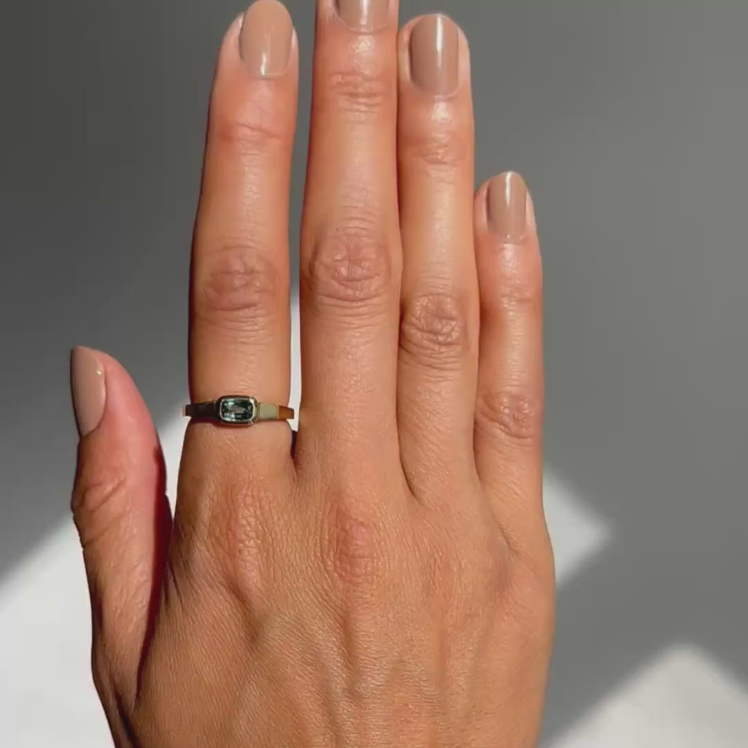Green Sapphire ring on hand
